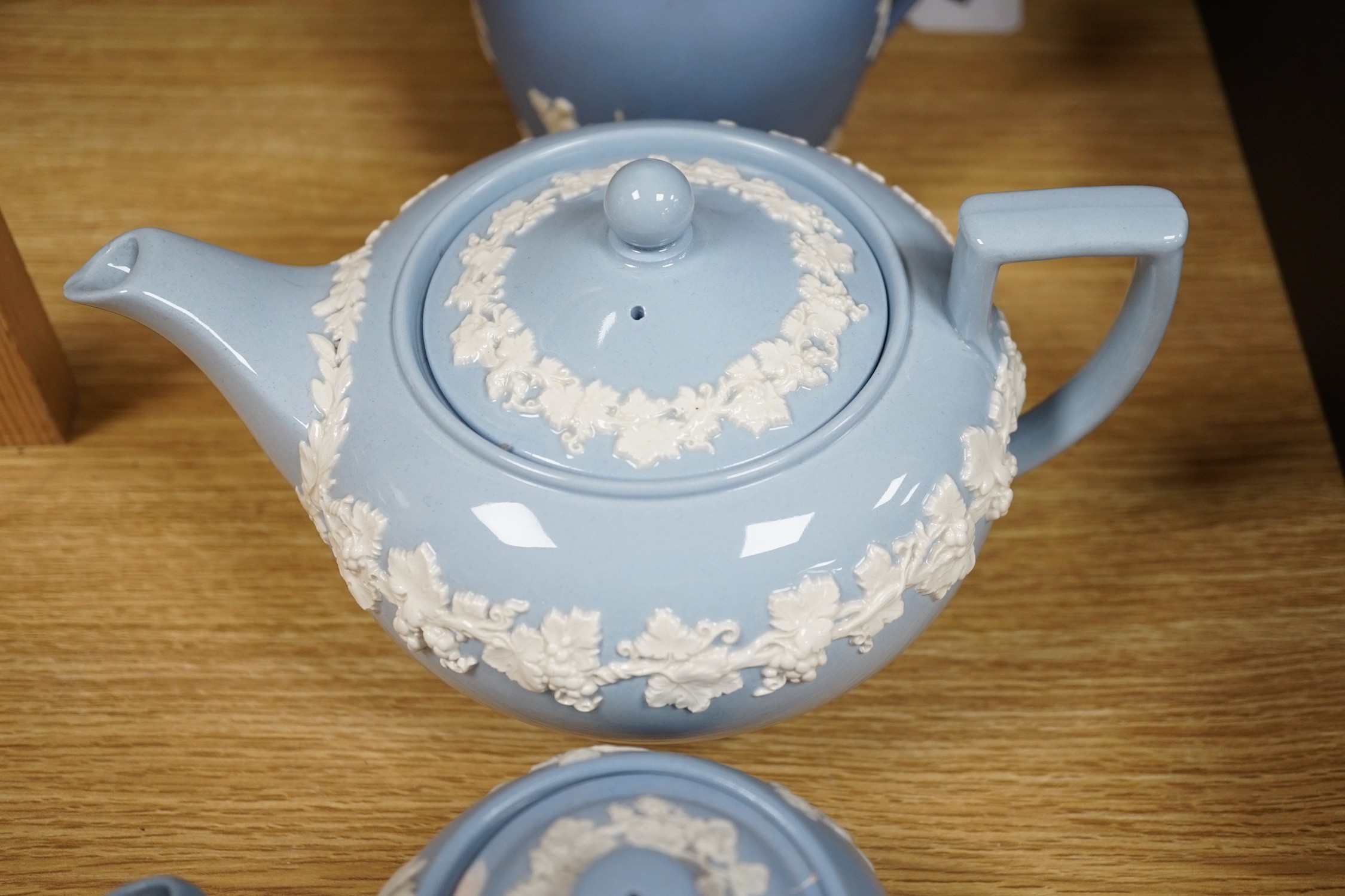 A group of Wedgwood and Wedgwood-style jasperware teapots and jugs.